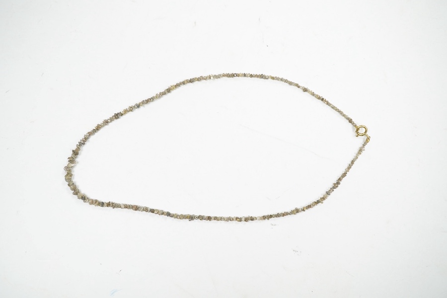 A single strand rough cut diamond necklace, with 750 yellow metal clasp, 40cm. Condition - fair